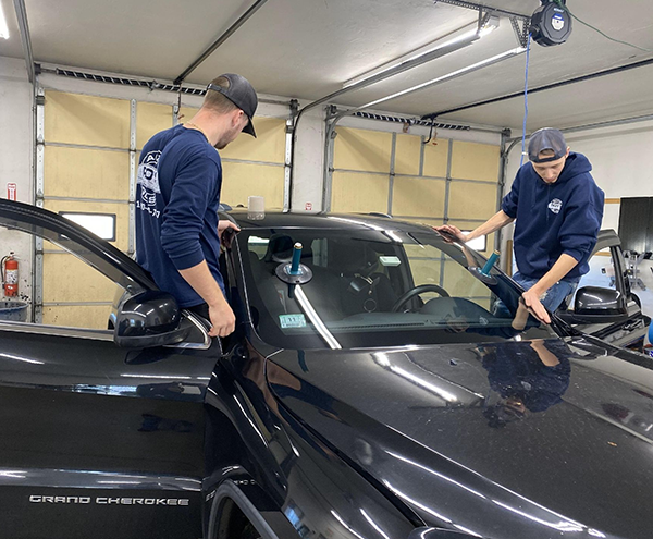 Mobile windshield repair in garage